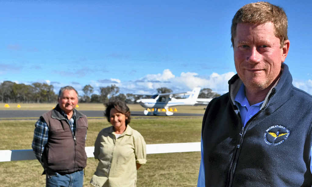 UNCERTAIN: Queensland Recreation Aircraft Association president Kelvin Hutchinson (front) with life members Bill and Val Wilkinson are concerned about the lack of consultation from Ergon Energy. UNCERTAIN: Queensland Recreation Aircraft Association president Kelvin Hutchinson (front) with life members Bill and Val Wilkinson are concerned about the lack of consultation from Ergon Energy.